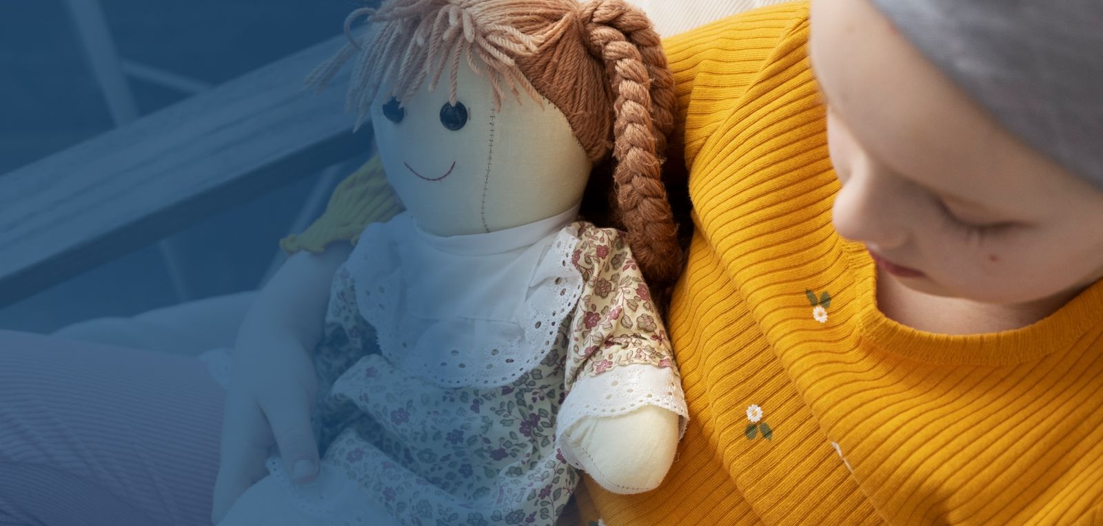 little girl with doll
